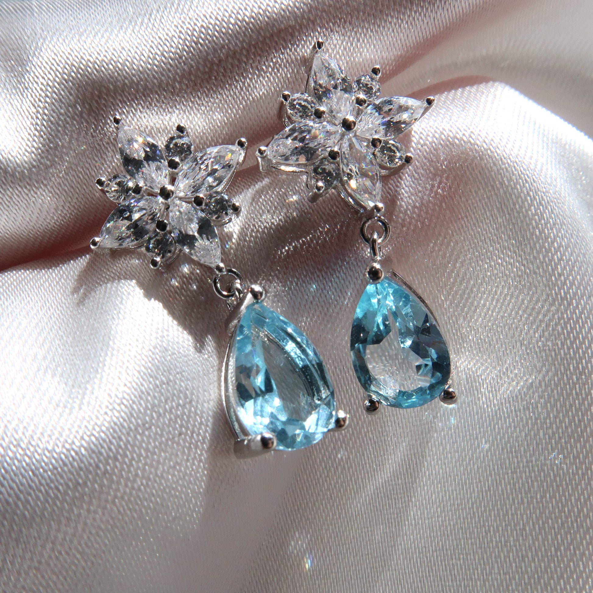 1.5 Carat Pear Blue Topaz 18K White Gold Flower Diamond Drop Earrings - Lush and Company